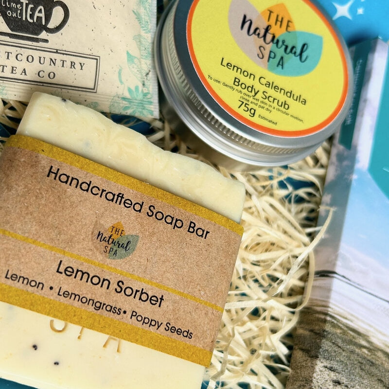 Letterbox Pamper Gift Set from Sand and Sparkle - packed with Devon and Cornish artisan products including lemon calendula body scrub, handmade lemon sorbet soap, Kernow Chocolate and enveloped tea bags.