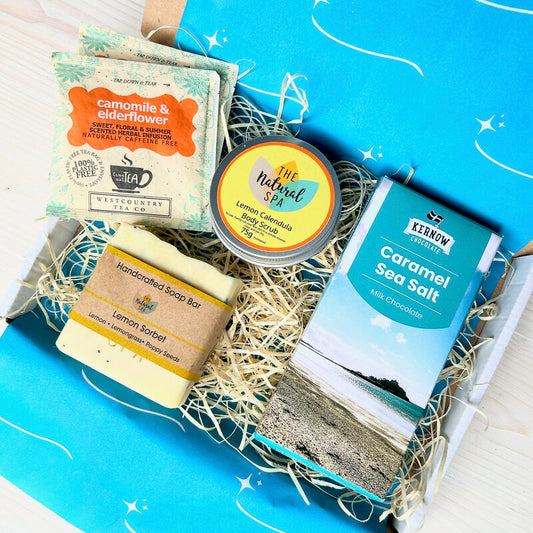 Letterbox Pamper Gift Set from Sand and Sparkle - packed with Devon and Cornish artisan products including lemon calendula body scrub, handmade lemon sorbet soap, Kernow Chocolate and enveloped tea bags.