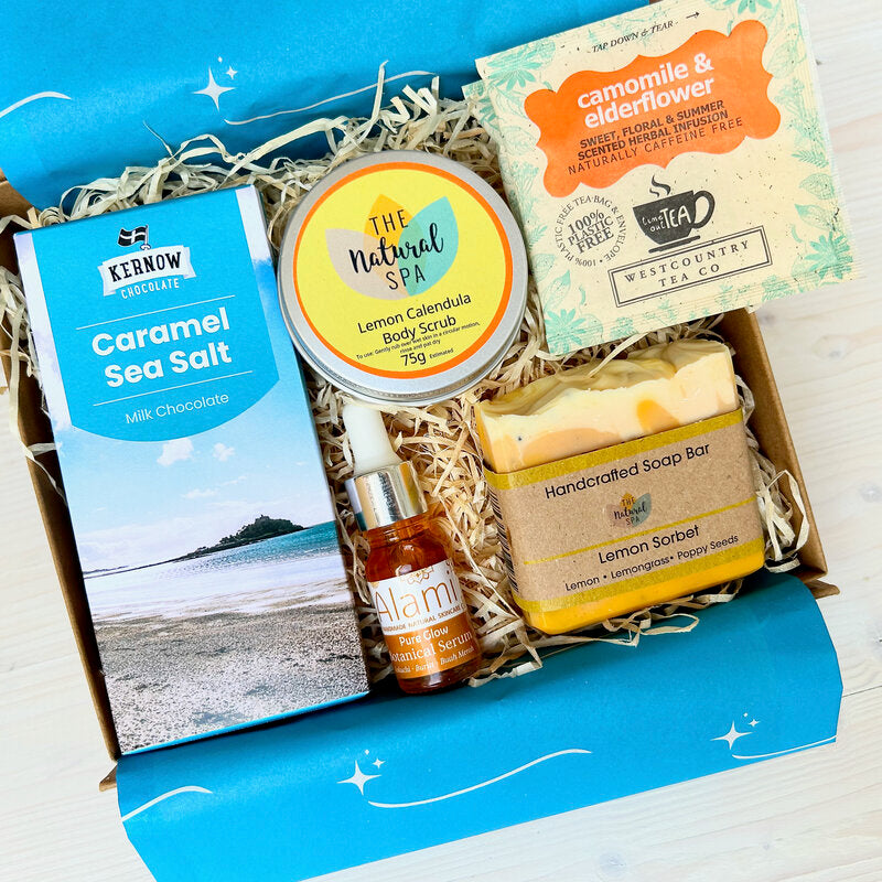 Pamper Hamper Gift Set from Sand & Sparkle with all natural skincare products including handmade lemon soap, body scrub, luxurious facial oil, artisan chocolate and herbal tea from Devon and Cornish artisans