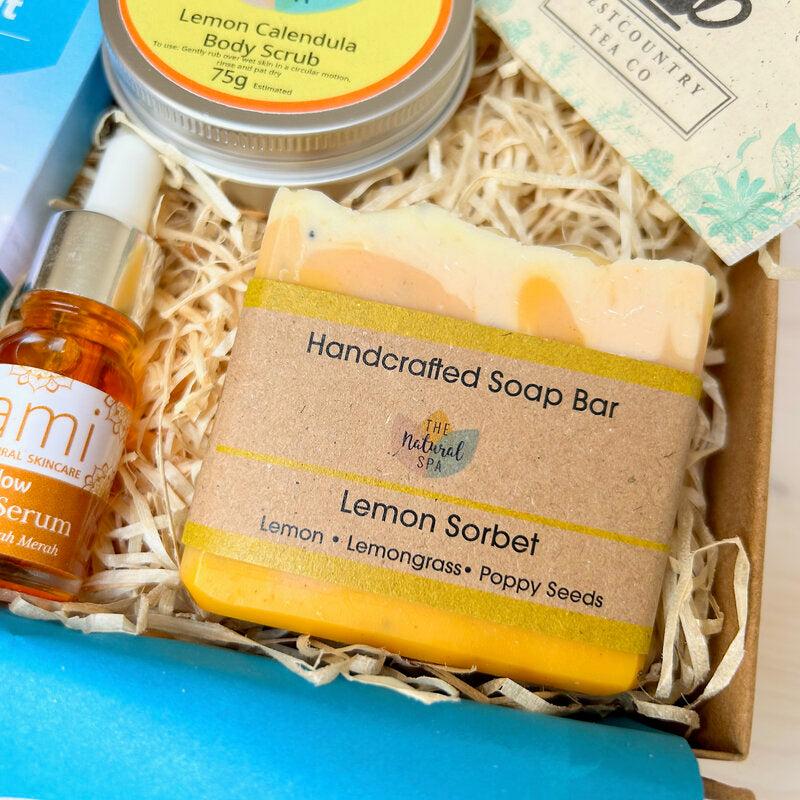 Pamper Hamper Gift Set from Sand & Sparkle with all natural skincare products including handmade lemon soap, body scrub, luxurious facial oil, artisan chocolate and herbal tea from Devon and Cornish artisans