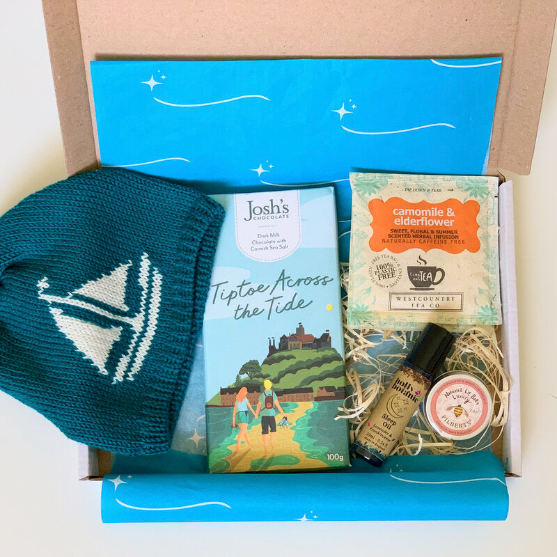 New Mum Letterbox Gift Set with Cornish merino baby beanie, Cornish chocolate, Cornish herbal tea and Devon made aromatherapy sleep oil